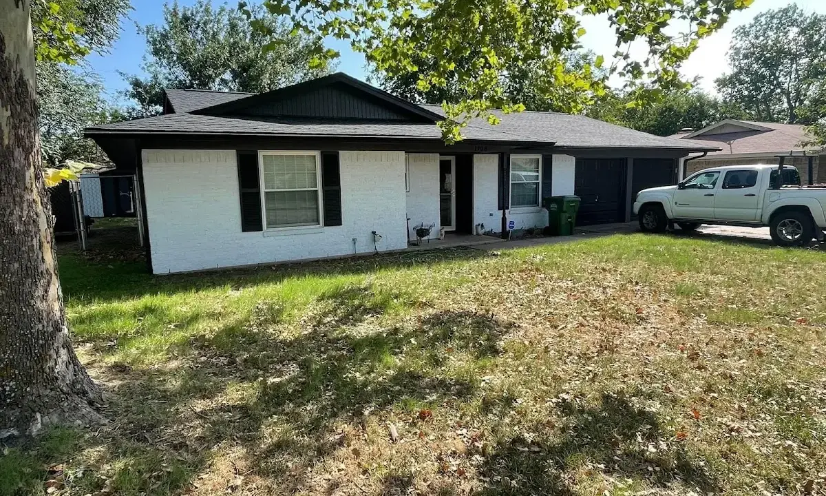 Professional roofing crew working on a residential roof in Lake Havasu City